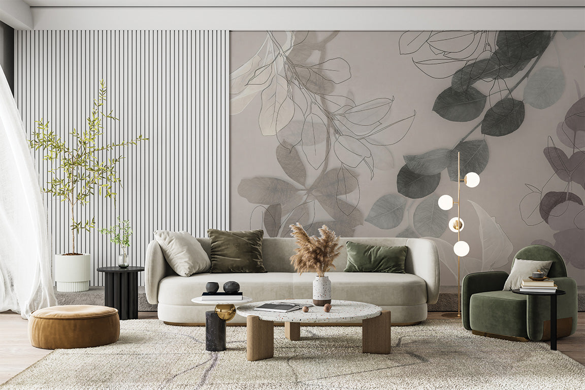 A soft, botanical-themed illustration featuring delicate overlapping leaves and stems in muted shades of gray, green, and blue. The translucent effect and hand-drawn outlines create a modern, airy design with an elegant, natural feel.