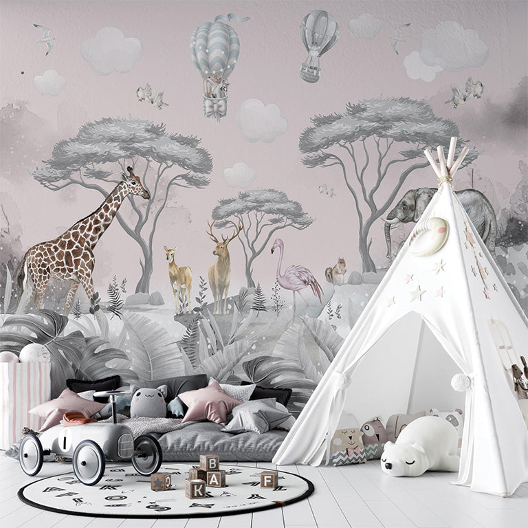 This illustration showcases a serene jungle scene with a soft pink backdrop. It features a giraffe, flamingo, deer, and elephants amidst acacia trees, tropical foliage, and delicate flowers. The sky above includes whimsical hot air balloons, soft clouds, and flying birds, creating a dreamy, safari-inspired atmosphere.