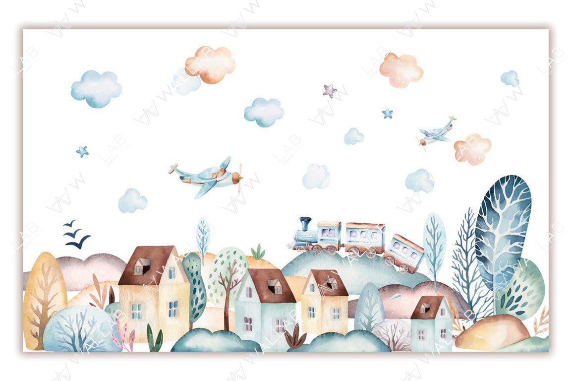 whimsical watercolor scene depicts a quaint village with soft pastel houses surrounded by colorful trees and rolling hills. Above, vintage airplanes fly among fluffy clouds and stars, while a charming train winds its way through the landscape. The dreamy, playful illustration evokes a sense of gentle exploration and nostalgia.