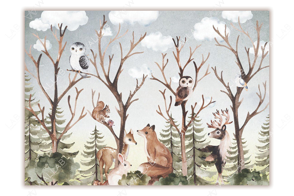 This charming woodland illustration depicts a variety of forest animals nestled among bare tree branches, surrounded by a lush forest backdrop under a cloudy sky. Animals like owls, a fox, deer, a squirrel, and a rabbit interact in a whimsical, peaceful setting.