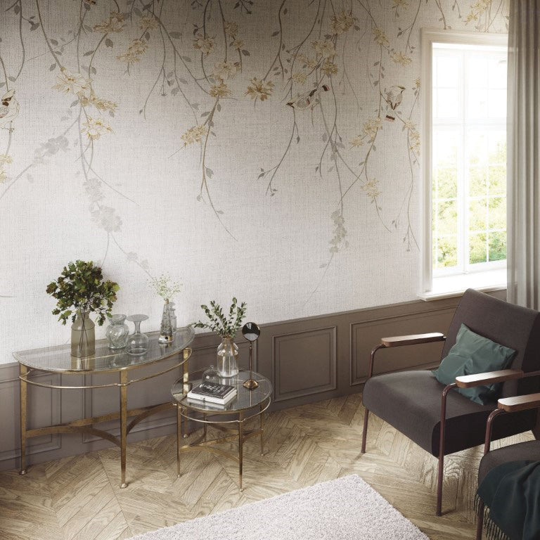 A delicate wallpaper mural featuring cascading floral vines with soft blossoms against a textured background. Small birds perched among the branches add charm and a sense of liveliness to the design. Perfect for creating a serene and nature-inspired atmosphere in any room.