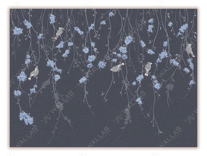 A delicate wallpaper mural featuring cascading floral vines with soft blossoms against a textured background. Small birds perched among the branches add charm and a sense of liveliness to the design. Perfect for creating a serene and nature-inspired atmosphere in any room.