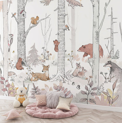 This whimsical woodland illustration depicts a lively forest scene filled with various animals such as a bear, playful bear cubs climbing trees, a deer and fawn resting, rabbits, and a badger among the foliage. Birds, including a woodpecker and robin, add charm to the serene setting, while a squirrel perches near a birdhouse on a birch tree.