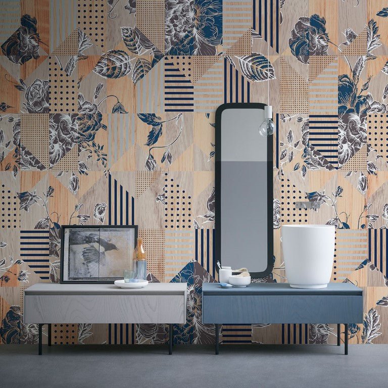 A patchwork-inspired design combining floral motifs with geometric patterns such as stripes, dots, and grids. The color palette blends warm beige and orange tones with deep navy and soft neutrals, creating a harmonious balance. The intricate mix of textures and elements adds a modern yet vintage charm.